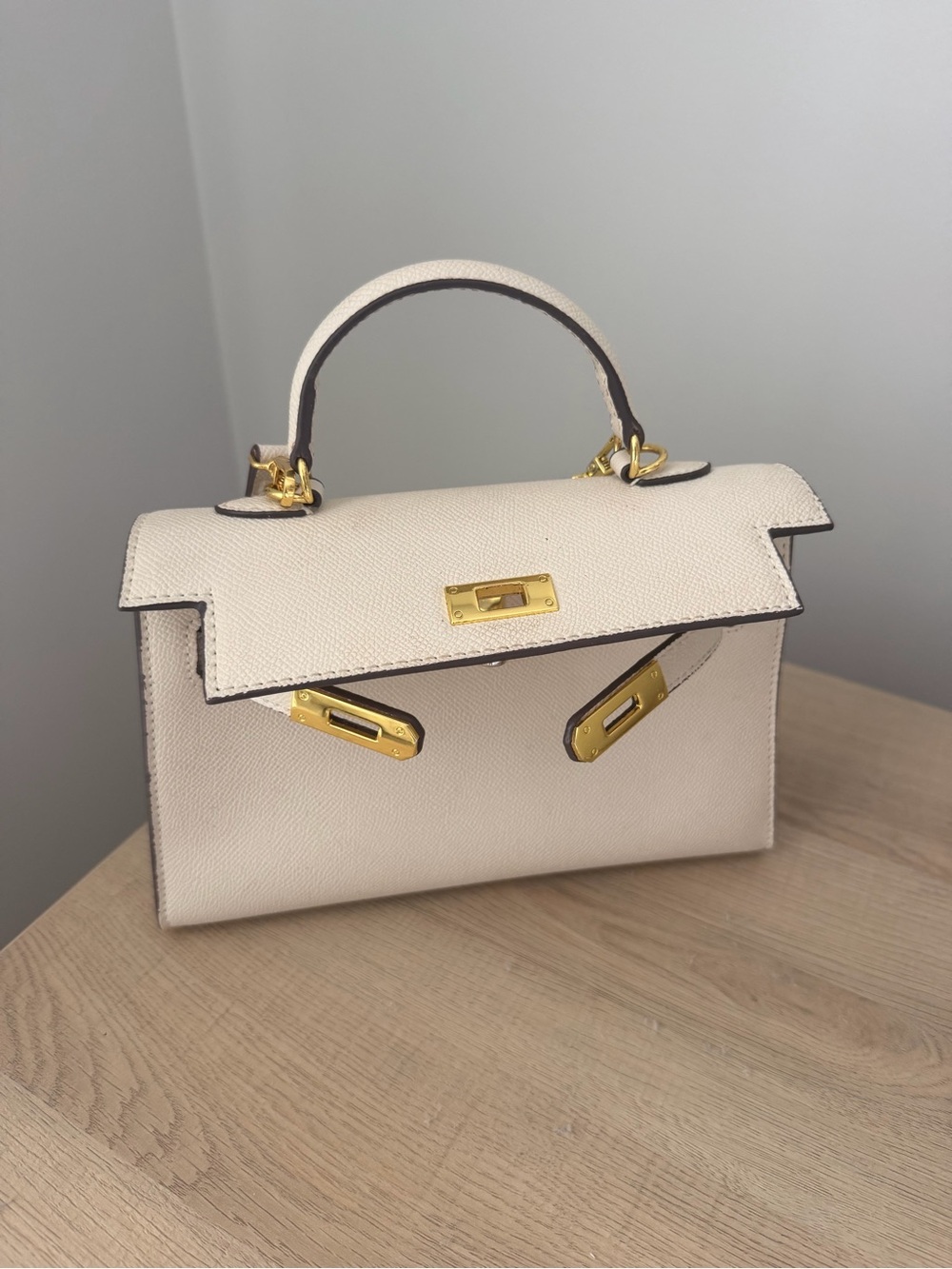 Elegant Cream Top-Handle Women's Bag with Gold Hardware